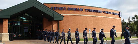 Police Academy trainees walking out of the Regional Emergency Training Center